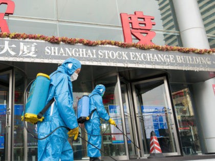 Medical workers spray antiseptic outside of the main gate of Shanghai Stock Exchange Build