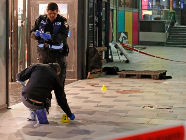 Israeli police cordon off the scene of a knife attack outside a shopping centre in the sou