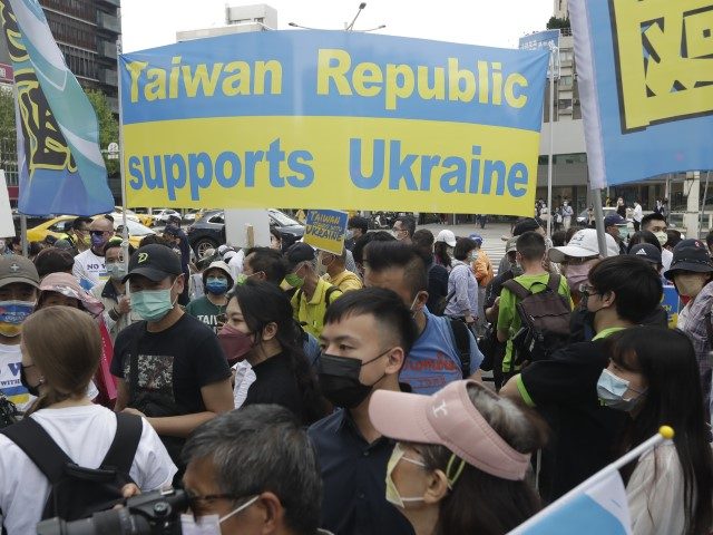 Ukrainian nationals in Taiwan and supporters protest against the invasion of Russia during a march in Taipei, Taiwan, Sunday, March 13, 2022.