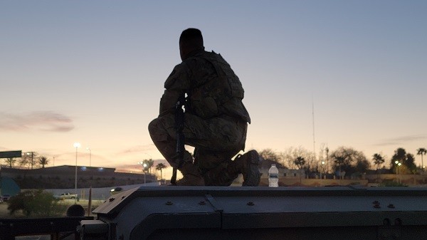 A Texas National Guard Soldier monitors the Rio Grande near Eagle Pass. (Bob Price/Breitbart Texas)