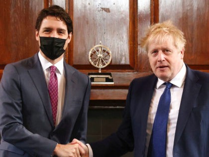 British Prime Minister Boris Johnson, right, shakes hands with Canadian Prime Minister Jus