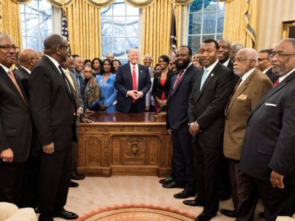 US President Donald Trump and leaders of historically black universities and colleges pose for a group photo in the Oval Office of the White House before a meeting with US Vice President Mike Pence February 27, 2017 in Washington, DC.