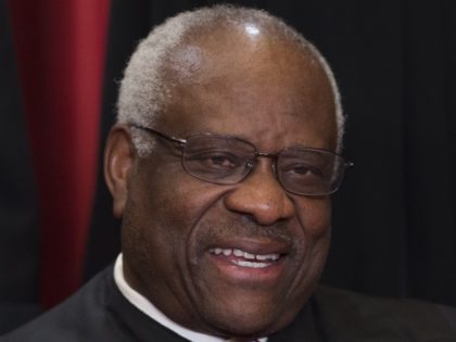 DEI - US Supreme Court Associate Justice Clarence Thomas sits for an official photo with o