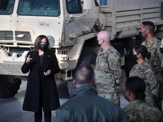 U.S. Vice President Kamala Harris, left, meets with U.S. and Polish troops at Warsaw Chopin International Airport, in Warsaw, Poland, Friday, March 11, 2022.