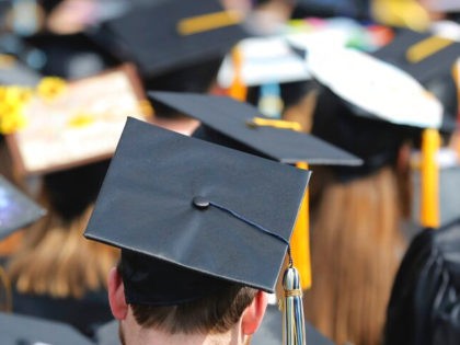 In this May 5, 2018, file photo, students attend the University of Toledo commencement ceremony in Toledo, Ohio. Colleges across the U.S. have begun cancelling and curtailing spring graduation events amid fears that the new coronavirus will not have subsided before the stretch of April and May when schools typically …