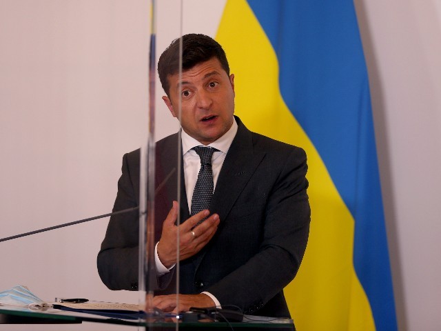 Ukrainian President Volodymyr Zelensky speaks to the media during a joint press conference with Austrian Chancellor Sebastian Kurz after their meeting at the Federal Chancellery in Vienna, Austria, Tuesday, September 15, 2020. (AP Photo/Ronald Zak)