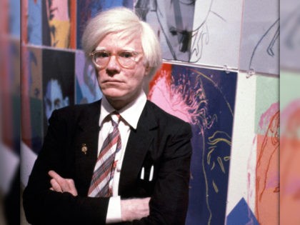 The American artist and filmmaker Andy Warhol with his paintings(1928 - 1987), December 15, 1980.