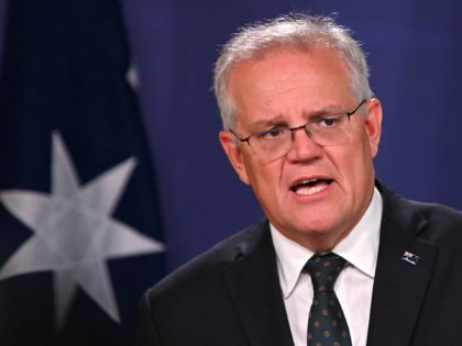 Australia's Prime Minister Scott Morrison speaks to the media to announce sanctions on top