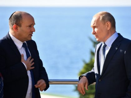 Russian President Vladimir Putin (R) speaks with Israeli Prime Minister Naftali Bennett during their meeting, in Sochi, on October 22, 2021. (Photo by Yevgeny BIYATOV / Sputnik / AFP) (Photo by YEVGENY BIYATOV/Sputnik/AFP via Getty Images)