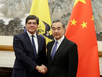 Chinese Foreign Minister Wang Yi meets Ecuador's Foreign Minister Jose Valencia (L) at the Diaoyutai State Guesthouse in Beijing on November 1, 2019. (Photo by JASON LEE / POOL / AFP) (Photo by JASON LEE/POOL/AFP via Getty Images)