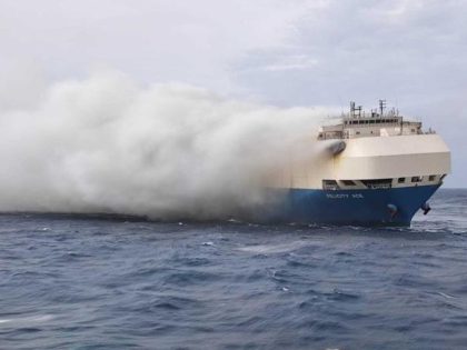 FILE - In this undated photo provided by the Portuguese Navy on Feb. 18, 2022, smoke billows from the burning Felicity Ace car transport ship as seen from the Portuguese Navy NPR Setubal ship southeast of the mid-Atlantic Portuguese Azores Islands. A large cargo vessel carrying cars from Germany to …