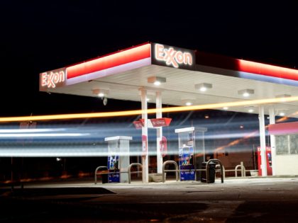 A vehicle drives past an Exxon gas station in Washington, DC, on March 13, 2022. - US consumer prices saw their biggest annual increase in more than 40 years last month, rising 7.9 percent compared to February 2021 as inflation continues to batter the economy, the government said on March …