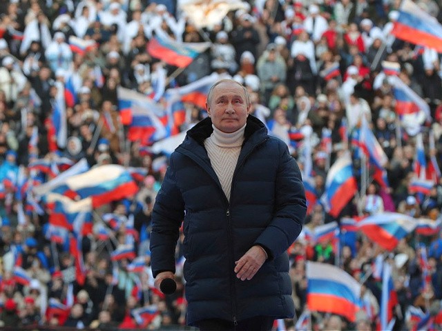 Russian President Vladimir Putin attends a concert marking the eighth anniversary of Russia's annexation of Crimea at the Luzhniki stadium in Moscow on March 18, 2022. (Photo by Mikhail KLIMENTYEV / SPUTNIK / AFP) (Photo by MIKHAIL KLIMENTYEV/SPUTNIK/AFP via Getty Images)