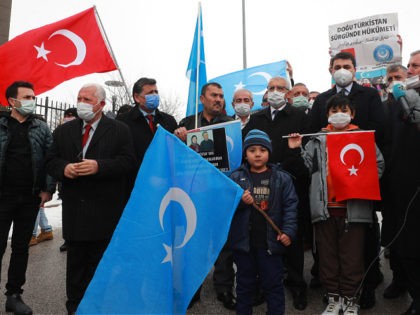 Uighurs living in Turkey attend a protest against the visit of China's State Councilor and Foreign Minister Wang Yi to the Turkish capital in front of the Chinese embassy in Ankara, on March 25, 2021. (Photo by Adem ALTAN / AFP) (Photo by ADEM ALTAN/AFP via Getty Images)