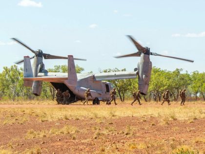 United States Marines exit a V-22 Osprey aircraft to provide security of a airfield, as part of Exercise Loobye a joint exercise between the Australian Defence Fore and the Marine Rotational Force – Darwin 2021, at Bradshaw Field Training Area.