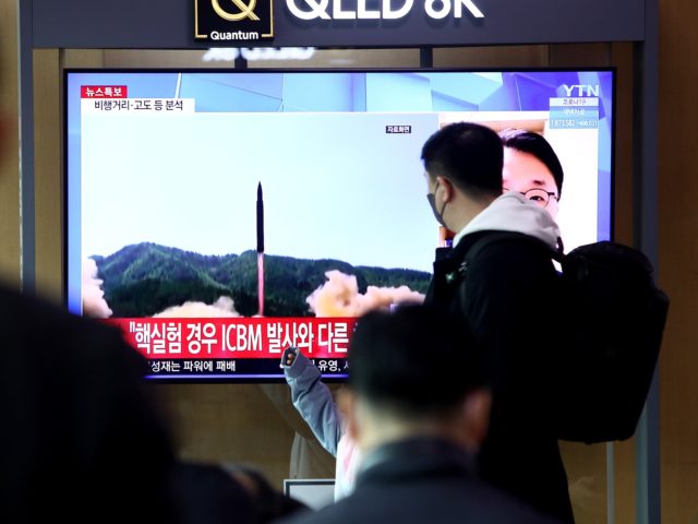 EOUL, SOUTH KOREA - MARCH 24: People watch a TV at the Seoul Railway Station showing a fil