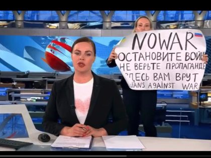 A protester stormed onto a live broadcast of Russia's top news show on Monday evening and shouted "Stop the war!" while waving a sign that read, "They’re lying to you here."