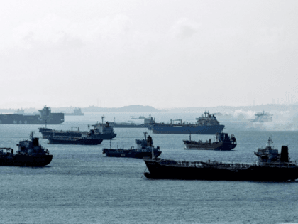 Oil tankers are anchored off the western shores of Singapore, where tycoon O.K. Lim built up his oil empire from a single-truck outfit through hard work and high-risk gambles, a rags-to-riches tale that made him a legend among crude traders © AFP/File Roslan RAHMAN