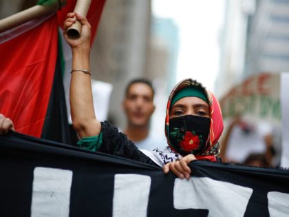 A woman attends a march in support of Palestinians in New York, August 29, 2021. (Photo by Kena Betancur / AFP) (Photo by KENA BETANCUR/AFP via Getty Images)