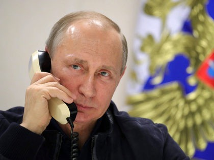 Russian President Vladimir Putin speaks by phone with his Turkish counterpart from aboard the Pioneering Spirit pipelaying ship in the Black Sea on June 23, 2017. - Russian President Vladimir Putin on Friday launched the deep-water phase of the TurkStream gas pipeline project, calling Turkey's Recep Tayyip Erdogan from a …