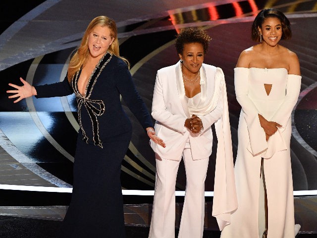 US actress and comedian Amy Schumer (L), US actress and comedian Wanda Sykes (C) and US actress Regina Hall speak onstage during the 94th Oscars at the Dolby Theatre in Hollywood, California on March 27, 2022. (Photo by Robyn Beck / AFP) (Photo by ROBYN BECK/AFP via Getty Images)