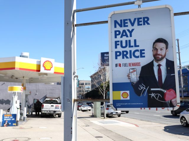 SAN FRANCISCO, CALIFORNIA - FEBRUARY 23: A customer pumps gas into his truck at a Shell ga