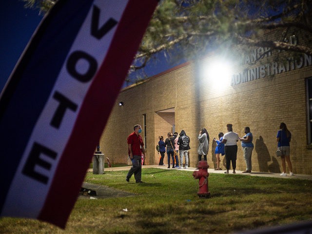 MANOR, TX - NOVEMBER 03: With an hour left to vote, people wait in line at Manor ISD Administration building on November 3, 2020 in Manor, Texas. After a record-breaking early voting turnout, Americans head to the polls on the last day to cast their vote for incumbent U.S. President …