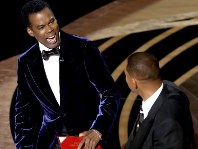 HOLLYWOOD, CALIFORNIA - MARCH 27: Will Smith appears to slap Chris Rock onstage during the