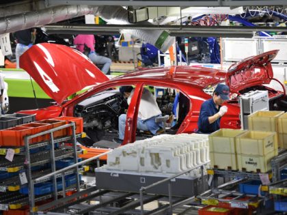 Workers assemble fourth generation Toyota Prius cars on the production line at the company's Tsutsumi assembly plant in Toyota City, Aichi prefecture on December 8, 2017. / AFP PHOTO / Toshifumi KITAMURA (Photo credit should read TOSHIFUMI KITAMURA/AFP via Getty Images)