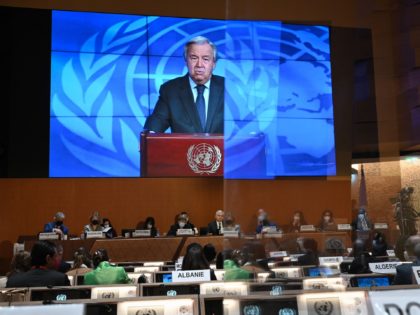 UN Secretary-General Antonio Guterres appears on a screen as he delivers a remote speech at the opening of a session of the UN Human Rights Council on February 28, 2022 in Geneva. - The UN Human Rights Council voted to hold an urgent debate about Russia's deadly invasion of Ukraine …
