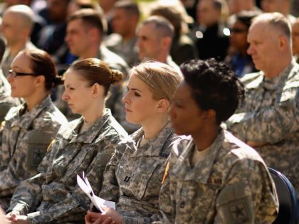 ARLINGTON, VA - MARCH 31: Soldiers, officers and civilian employees attend the commencement ceremony for the U.S. Army's annual observance of Sexual Assault Awareness and Prevention Month in the Pentagon Center Courtyard March 31, 2015 in Arlington, Virginia. In conjunction with the national campaign against sexual assault, The Army announced …
