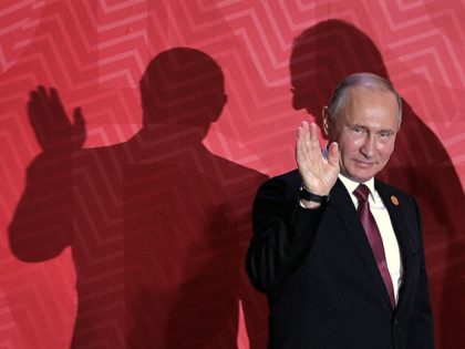 Russia's President Vladimir Putin waves as he arrives at the Lima Convention Centre for the APEC Leaders' Retreat on the last day of the Asia-Pacific Economic Cooperation (APEC) Summit in Lima on November 20, 2016. - Asia-Pacific leaders are expected to send a strong message in defense of free trade …