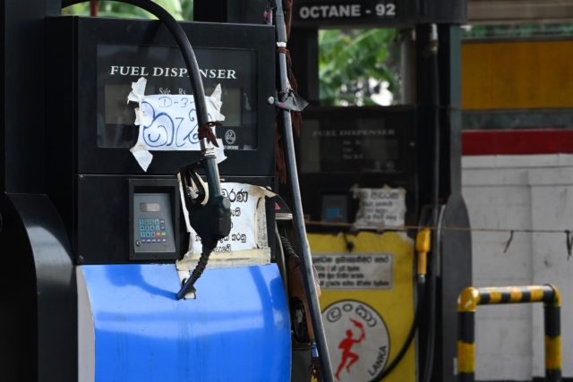 Boards reading 'No fuel' are seen at a closed Ceylon Petroleum Corporation fuel station in