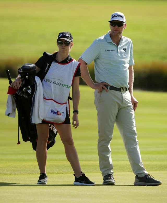 Ryan Brehm and his wife and caddie Chelsey Brehm prepare to play a shot in the second roun