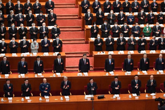 China's President Xi Jinping (C), seen here in Beijing on March 8, 2022, has urged 'maximu