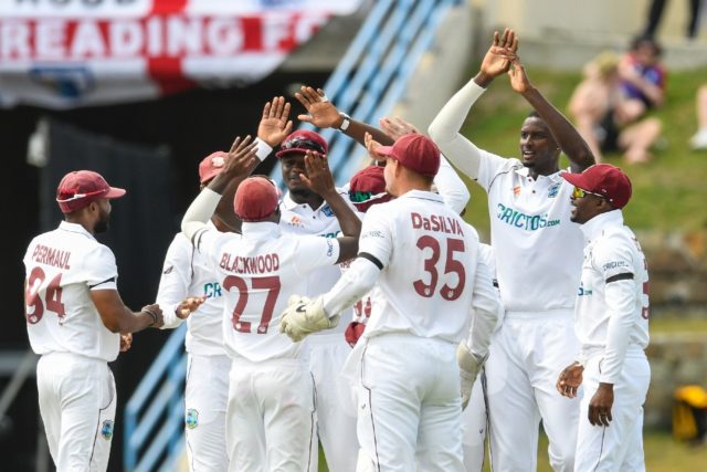 Jason Holder (2nd right) celebrates the dismissal of Dan Lawrence