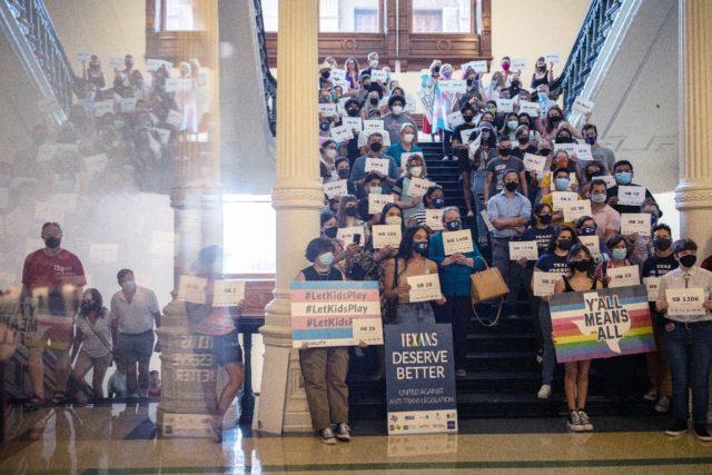 LGBTQ rights supporters gather at the Texas State Capitol to protest state Republican-led