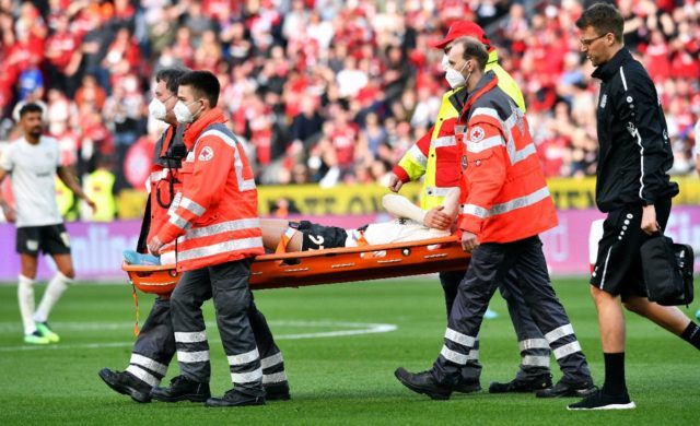 Leverkusen's Germany forward Florian Wirtz is stretchered off