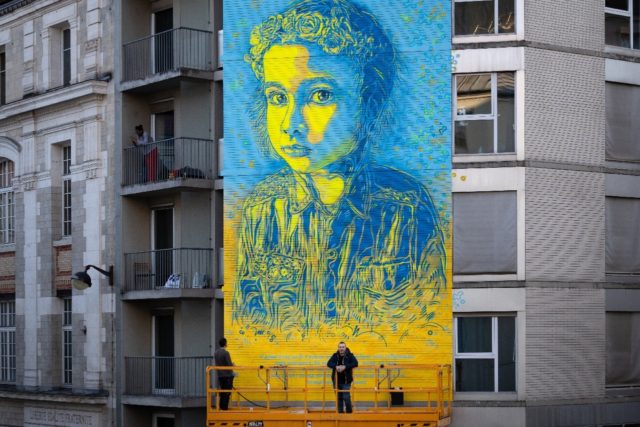 C215's mural carries a quote from Zelensky: "I am neither a god nor an icon... hang pictur