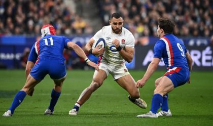 Centre of attention - England's Joe Marchant (C) is confronted by Gabin Villiere (L) and Antoine Dupont during France's 25-13 Grand Slam-clinching win at the Stade de France on March 19