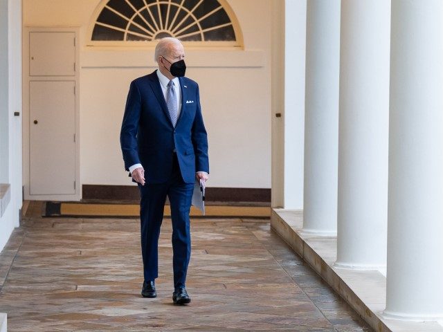 President Joe Biden walks along the West Colonnade of the White House, Friday, February 4,