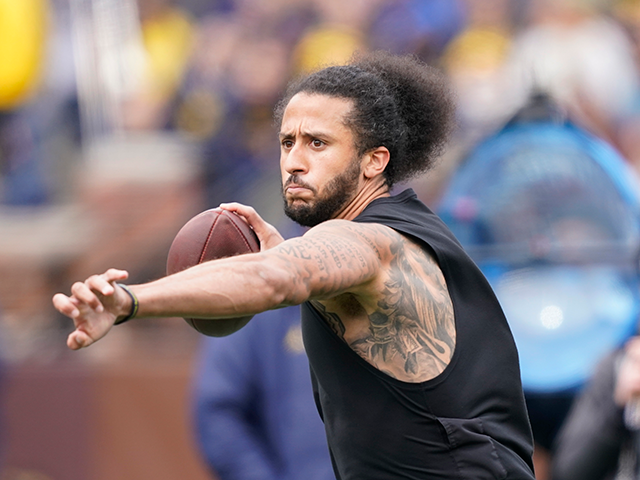 Former NFL quarterback Colin Kaepernick throws during halftime of an NCAA college football