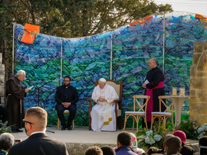 Pope Francis listens to Franciscan Friar Dionysius Mintoff, left, as he welcomes him at the 'John XXIII Peace Lab' center for migrants he founded in 1971 in Hal Far, Malta, Sunday, April 3, 2022. Pope Francis prayed for the world to show more kindness and compassion to refugees as he …