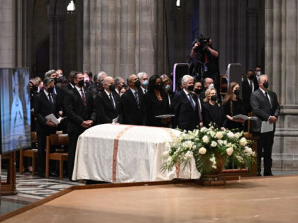 Guest listen at the funeral service of former Secretary of State Madeleine Albright at the Washington National Cathedral in Washington, DC, on April 27, 2022. (Photo by Brendan SMIALOWSKI / AFP) (Photo by BRENDAN SMIALOWSKI/AFP via Getty Images)