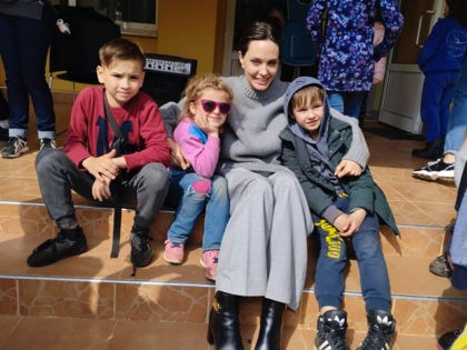 In this image provided by the Lviv city hall Angelina Jolie, Hollywood movie star and UNHCR goodwill ambassador, poses for photo with kids in Lviv, Ukraine, Saturday, Apr. 30, 2022. Ms Jolie was in Ukraine to meet the children affected by the war and visited hospitals and NGOs helping the …