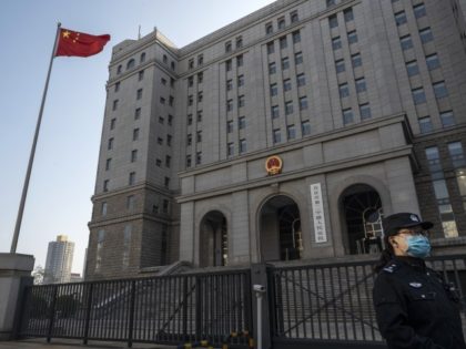 A police officer stands outside before the trial of Chinese Australian journalist Cheng Lei at the Beijing Number 2 Intermediate People's Court on March 31, 2022 in Beijing, China. Cheng Lei, who was a prominent business journalist for China's state-run international network CGTN, was initially detained in 2020 and later …
