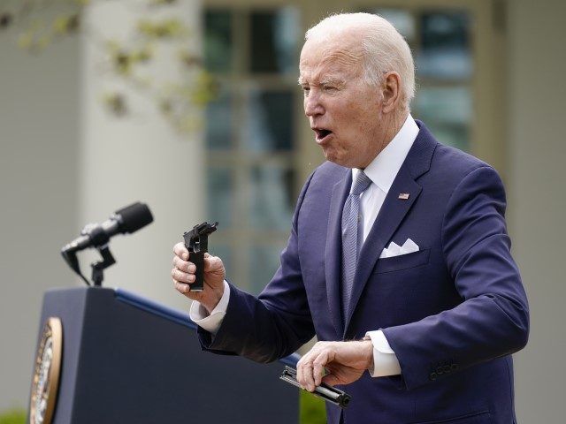 President Joe Biden holds pieces of a 9mm pistol as he speaks in the Rose Garden of the White House in Washington, Monday, April 11, 2022. Biden announced a final version of the administration's ghost gun rule, which comes with the White House and the Justice Department under growing pressure …