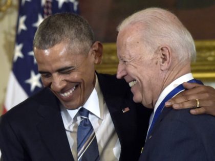 President Barack Obama laughs with Vice President Joe Biden during a ceremony in the State Dining Room of the White House in Washington where Obama presented Biden with the Presidential Medal of Freedom, Jan. 12, 2017. (Susan Walsh, File/AP)