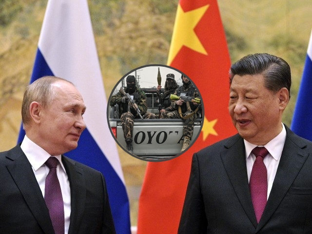 Chinese President Xi Jinping, right, and Russian President Vladimir Putin talk to each oth
