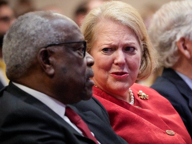 (L-R) Associate Supreme Court Justice Clarence Thomas sits with his wife and conservative activist Virginia Thomas while he waits to speak at the Heritage Foundation on October 21, 2021 in Washington, DC. Clarence Thomas has now served on the Supreme Court for 30 years. He was nominated by former President …